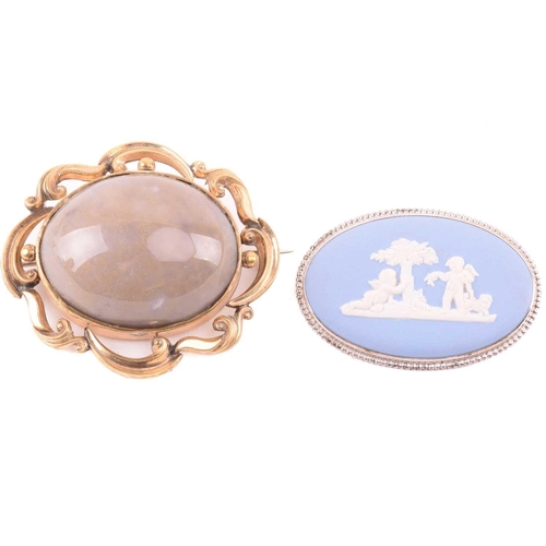 270 - An onyx and seed pearl brooch with a scrolling foliate design, marked 14k to the reverse, an oval sh... 