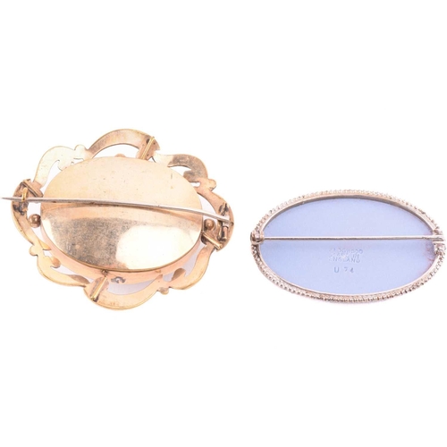 270 - An onyx and seed pearl brooch with a scrolling foliate design, marked 14k to the reverse, an oval sh... 