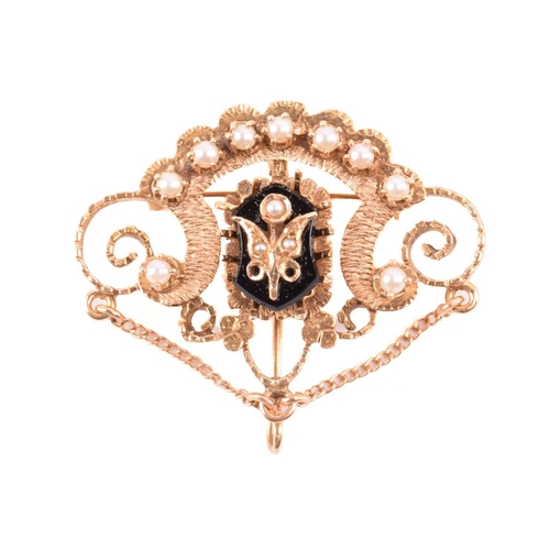 270 - An onyx and seed pearl brooch with a scrolling foliate design, marked 14k to the reverse, an oval sh... 