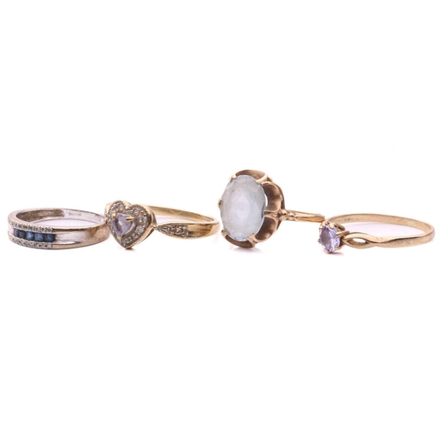276 - A sapphire and diamond ring, set with a row of square step cut sapphires between rows of single cut ... 
