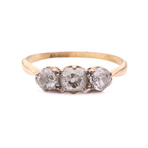 28 - A diamond three stone ring, set with a central cushion shape old cut diamond between round old cut d... 