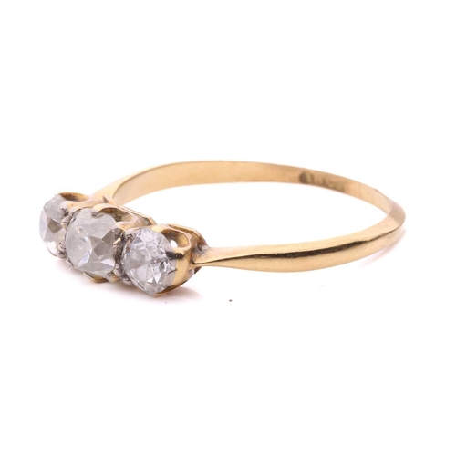 28 - A diamond three stone ring, set with a central cushion shape old cut diamond between round old cut d... 