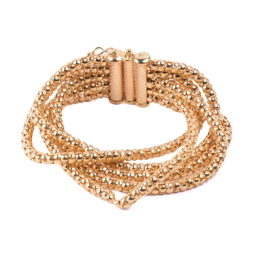 281 - A popcorn link bracelet in 9ct yellow gold, comprising five rows of popcorn links, fastened with a f... 