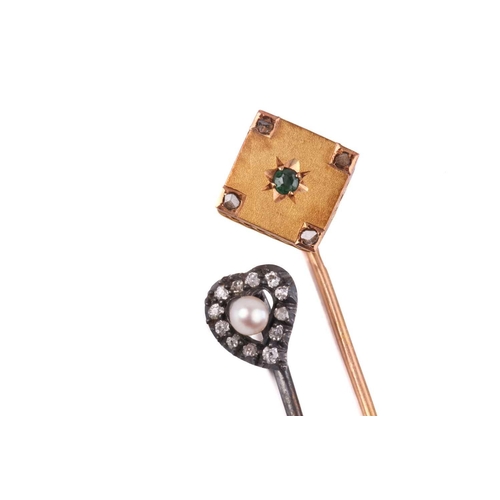289 - A Victorian heart-shaped diamond and pearl stick pin together with an emerald and diamond stick pin.... 