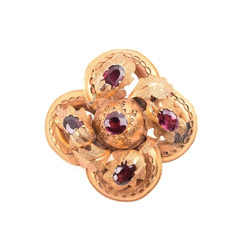 29 - A small collection of jewellery items; to include a Victorian garnet brooch, of quatrefoil form, set... 