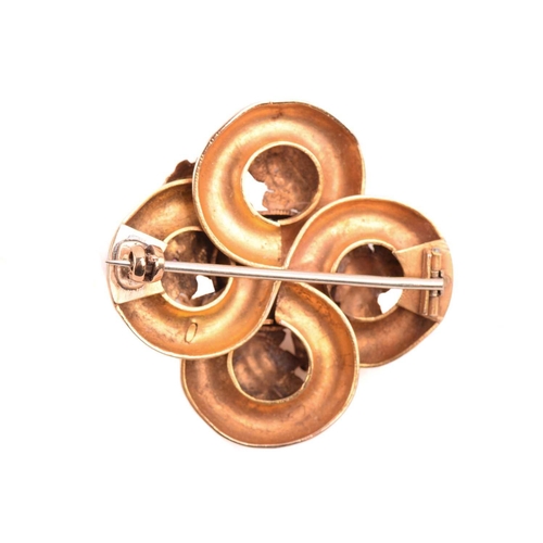 29 - A small collection of jewellery items; to include a Victorian garnet brooch, of quatrefoil form, set... 