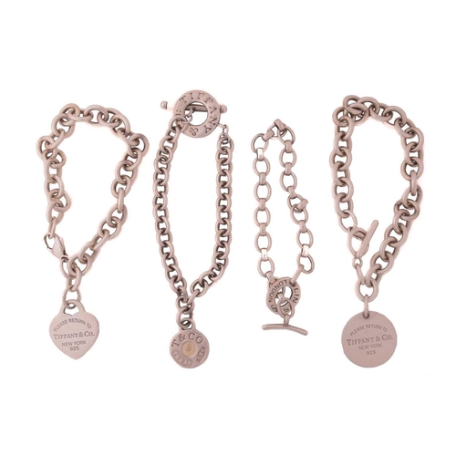 290 - Three Tiffany & co. cable link bracelets with charm and another; including a Return to Tiffany toggl... 
