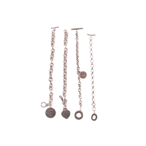290 - Three Tiffany & co. cable link bracelets with charm and another; including a Return to Tiffany toggl... 