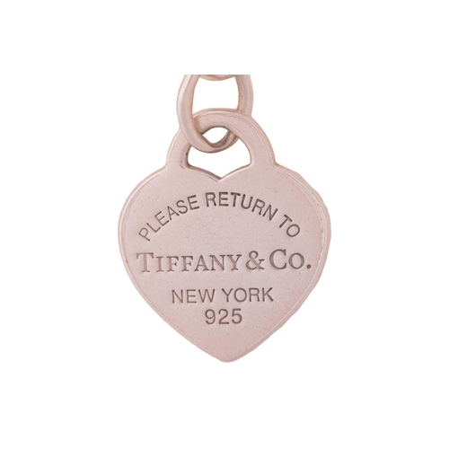 290 - Three Tiffany & co. cable link bracelets with charm and another; including a Return to Tiffany toggl... 