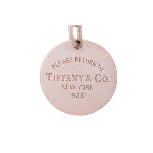 290 - Three Tiffany & co. cable link bracelets with charm and another; including a Return to Tiffany toggl... 