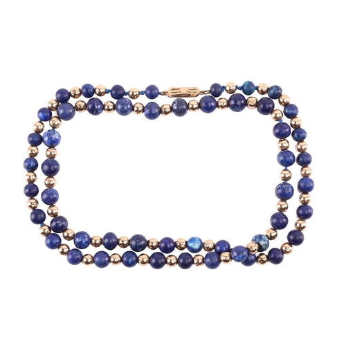 293 - A bead necklace with alternate sodalite and yellow metal graduated beads, to a clasp stamped '9ct', ... 