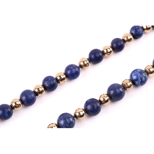 293 - A bead necklace with alternate sodalite and yellow metal graduated beads, to a clasp stamped '9ct', ... 
