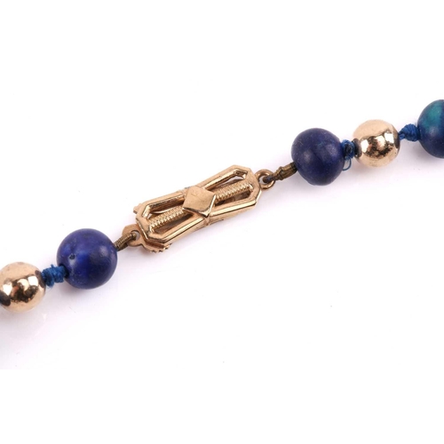 293 - A bead necklace with alternate sodalite and yellow metal graduated beads, to a clasp stamped '9ct', ... 