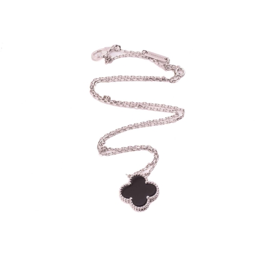 299 - Van Cleef & Arpels - an 18ct white gold and onyx 'Alhambra' pendant on chain, comprising the iconic ... 