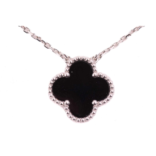 299 - Van Cleef & Arpels - an 18ct white gold and onyx 'Alhambra' pendant on chain, comprising the iconic ... 