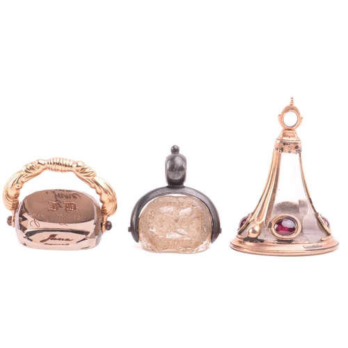 3 - A group of three 19th-century seal fobs; including a rock crystal three-sided swivel fob seal, one o... 