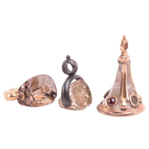 3 - A group of three 19th-century seal fobs; including a rock crystal three-sided swivel fob seal, one o... 