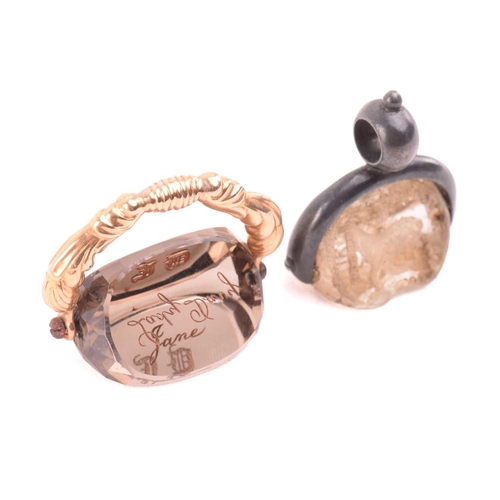 3 - A group of three 19th-century seal fobs; including a rock crystal three-sided swivel fob seal, one o... 