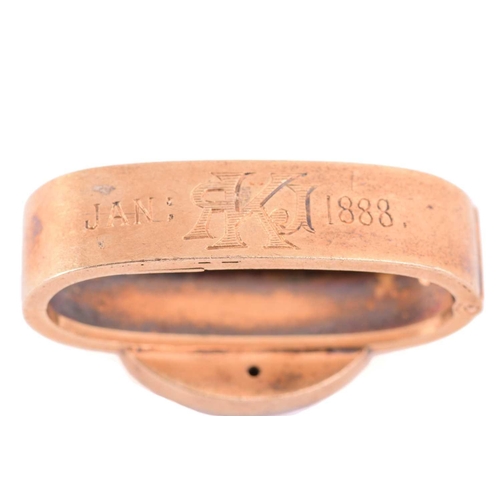 30 - A garnet-set serpent brooch, scarf clip and a tie pin; the serpent brooch with heart-shaped locket, ... 