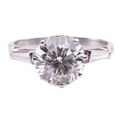 301 - A diamond solitaire ring, set to the centre with a round brilliant cut diamond with an estimated wei... 