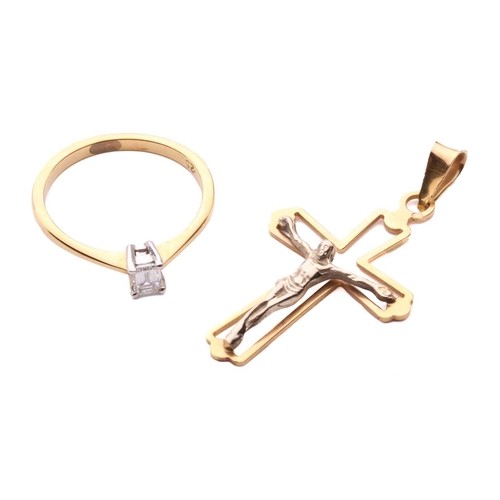 31 - A diamond solitaire ring and a crucifix pendant; the 18ct gold ring centred with an emerald-cut diam... 