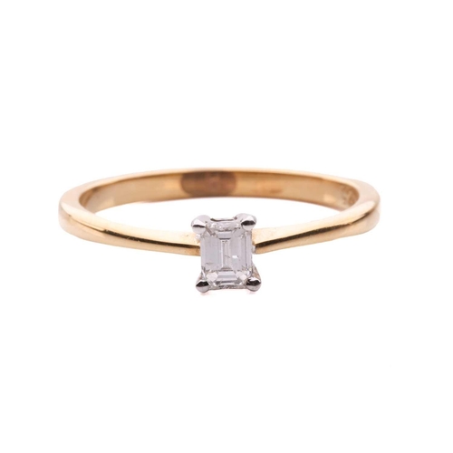 31 - A diamond solitaire ring and a crucifix pendant; the 18ct gold ring centred with an emerald-cut diam... 