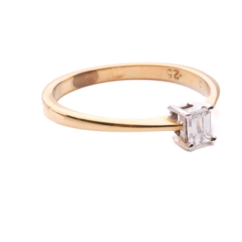 31 - A diamond solitaire ring and a crucifix pendant; the 18ct gold ring centred with an emerald-cut diam... 