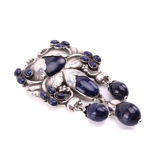 312 - Georg Jensen - a 'master brooch' of foliate design in sterling silver, set with sodalite cabochons a... 