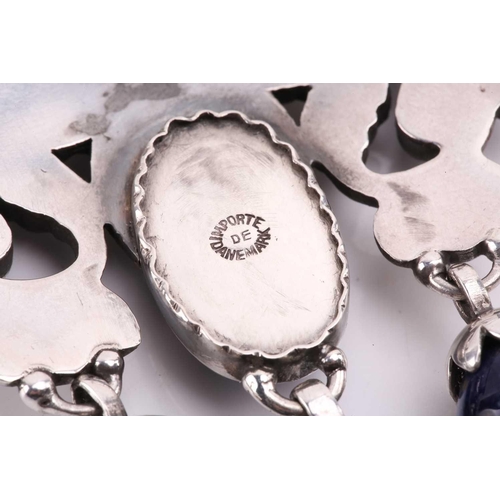 312 - Georg Jensen - a 'master brooch' of foliate design in sterling silver, set with sodalite cabochons a... 