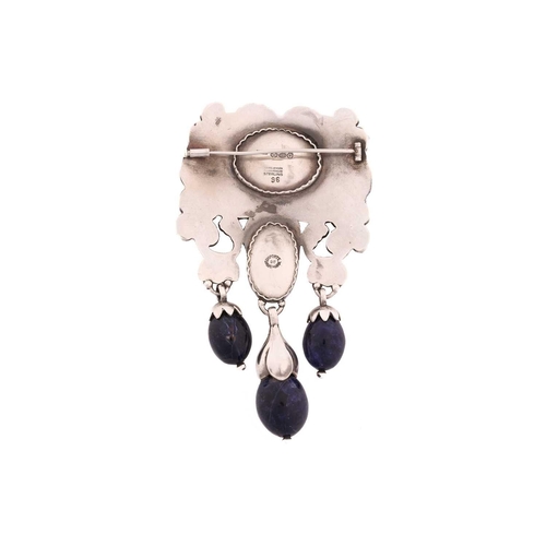 312 - Georg Jensen - a 'master brooch' of foliate design in sterling silver, set with sodalite cabochons a... 
