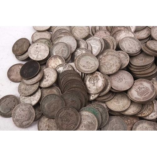 323 - A collection of pre-1947 silver one shillings, 74.3 ozt gross weight