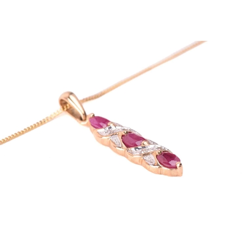 33 - A ruby necklace and earrings ensuite together with a dress ring; the pendant set with three oval-cut... 