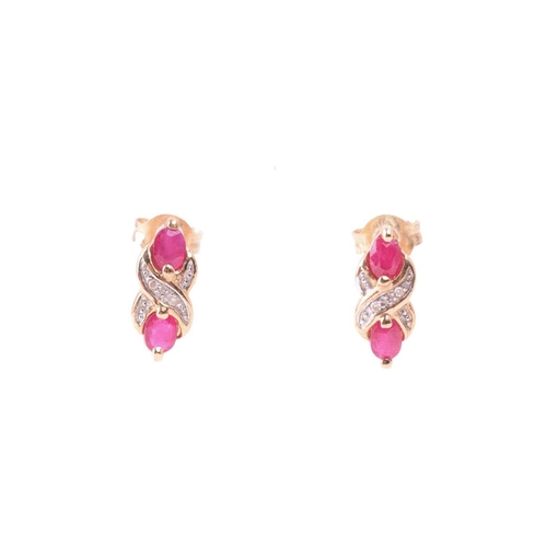 33 - A ruby necklace and earrings ensuite together with a dress ring; the pendant set with three oval-cut... 