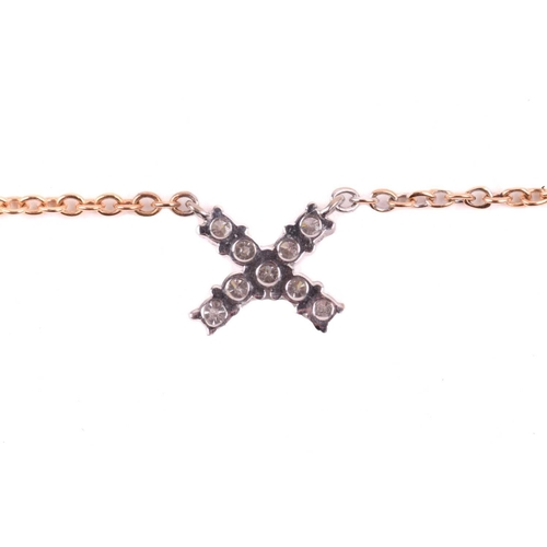 34 - A diamond kiss pendant, set with round brilliant cut diamonds with a total estimated weight of 0.30c... 