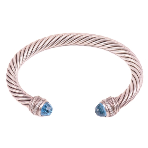 35 - A gem-set torque bangle by David Yurman, composed of twisted cables, terminating with diamond-set ro... 