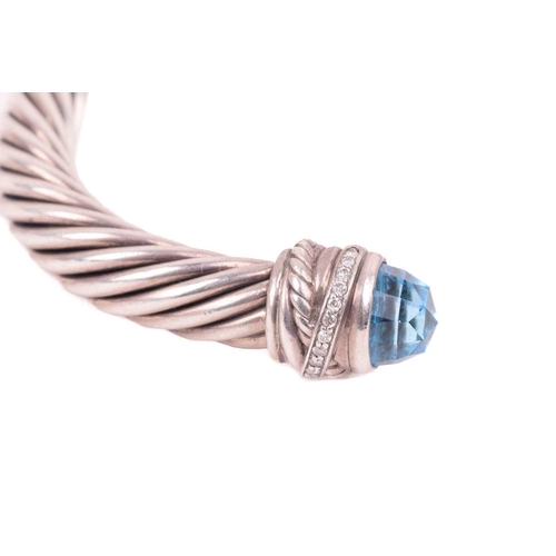 35 - A gem-set torque bangle by David Yurman, composed of twisted cables, terminating with diamond-set ro... 