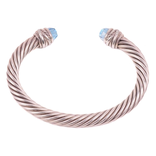 35 - A gem-set torque bangle by David Yurman, composed of twisted cables, terminating with diamond-set ro... 