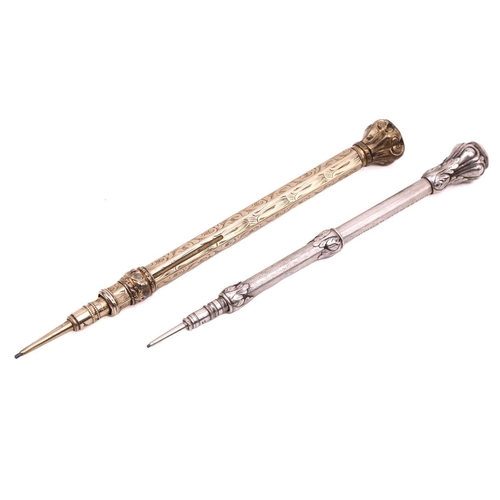 363 - A silver gilt propelling pencil, the shaft decorated with chased foliate decoration, the bulbous top... 