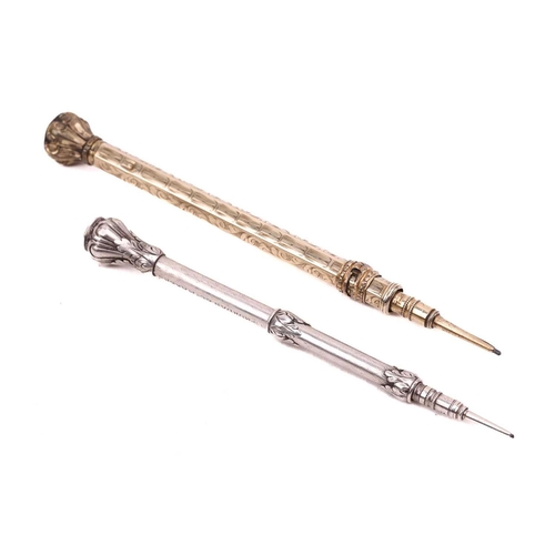 363 - A silver gilt propelling pencil, the shaft decorated with chased foliate decoration, the bulbous top... 