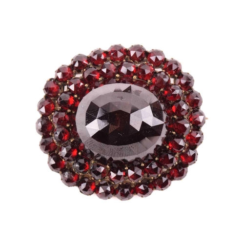 38 - A Victorian Bohemian garnet necklace, set with clusters and swags of garnets, with a length of 47cm,... 