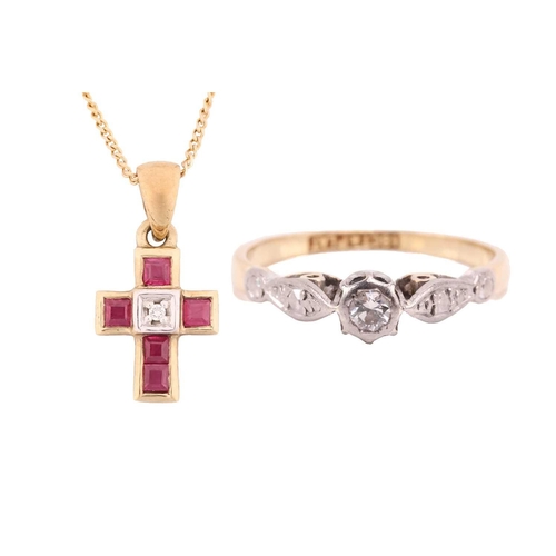 39 - A diamond solitaire ring and a gem-set cross on chain; the ring contains a brilliant-cut diamond in ... 