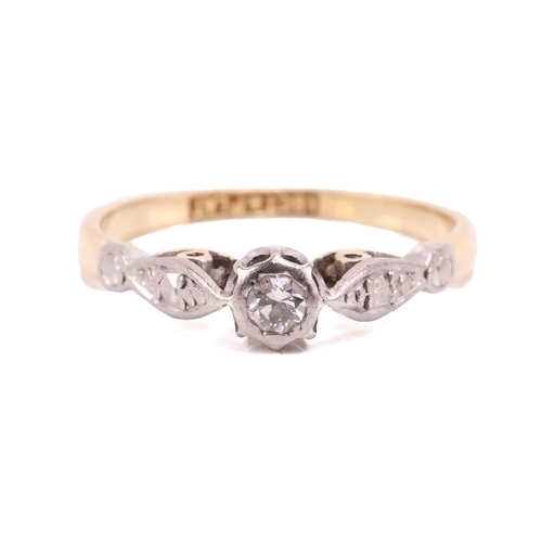39 - A diamond solitaire ring and a gem-set cross on chain; the ring contains a brilliant-cut diamond in ... 