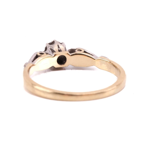 39 - A diamond solitaire ring and a gem-set cross on chain; the ring contains a brilliant-cut diamond in ... 