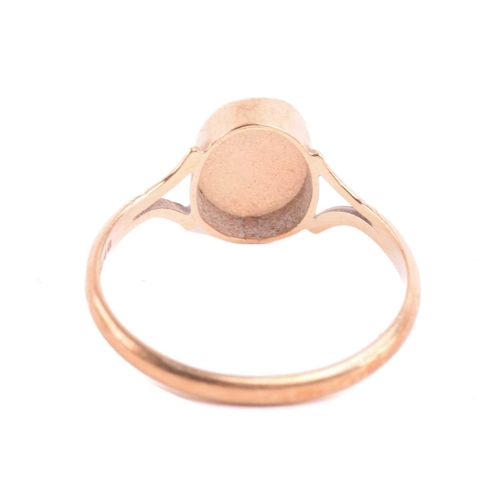 42 - An opal dress ring in 9ct gold and a diamond pendant on chain; the ring contains an oval cabochon of... 