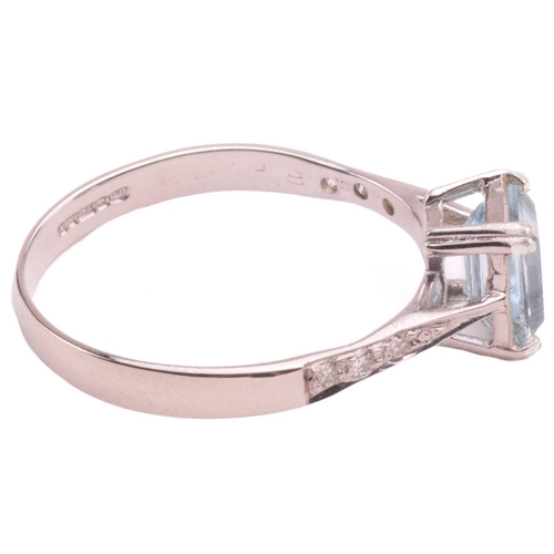 43 - An aquamarine and diamond ring, set with an emerald cut aquamarine measuring 7mm x 5.2mm, the should... 