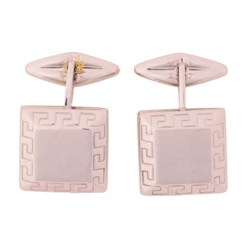 44 - A pair of square cufflinks, the bevelled head centred with a brushed finish panel, framed with a Gre... 