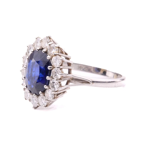 46 - A sapphire and diamond cluster ring, set to the centre with an oval sapphire measuring 11.1 x 8.7 x ... 