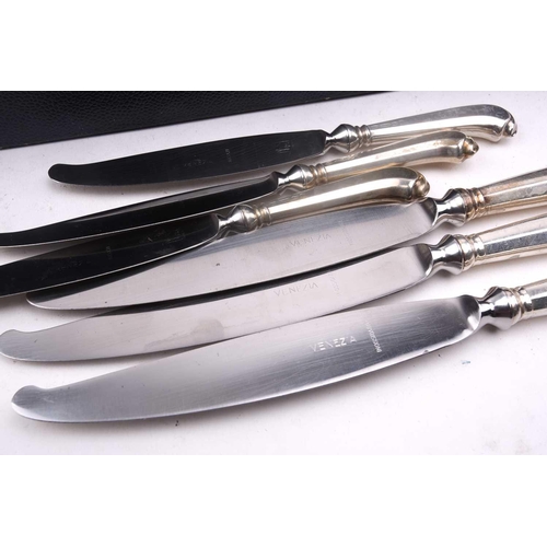 483 - An Italian white metal 800 standard canteen, comprising a bread knife, a serving spoon and fork, a s... 
