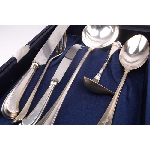 483 - An Italian white metal 800 standard canteen, comprising a bread knife, a serving spoon and fork, a s... 