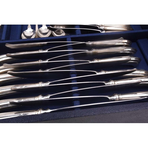 483 - An Italian white metal 800 standard canteen, comprising a bread knife, a serving spoon and fork, a s... 